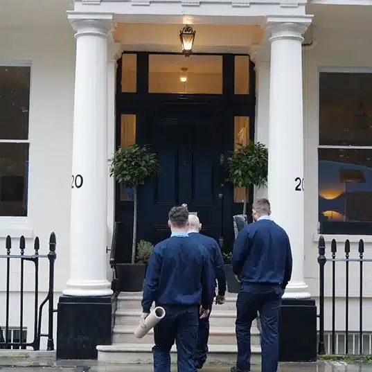 Professionally trained Abels staff entering a Chelsea property, reflecting our role as a leading removal company in Chelsea and the surrounding areas in London.